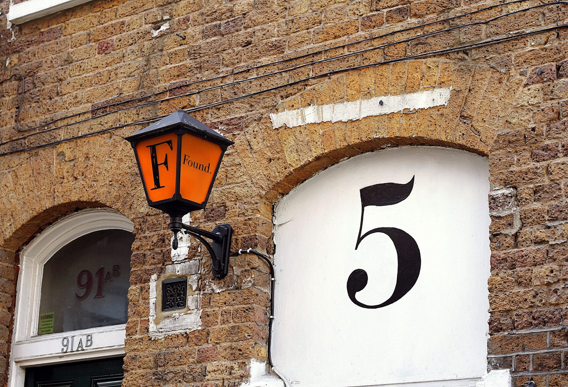 Numeral 5 on a building wall to illustrate five top tips